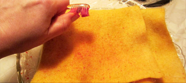 splatter food coloring on felted blanket recycled wool